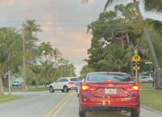 Should the intersection at the entrance of student parking be a four-way stop?