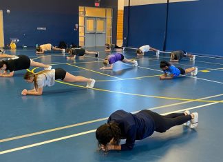 Varsity cheer preparations for spring season