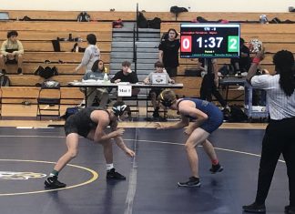 NHS Varsity Wrestling makes their way through districts and regionals